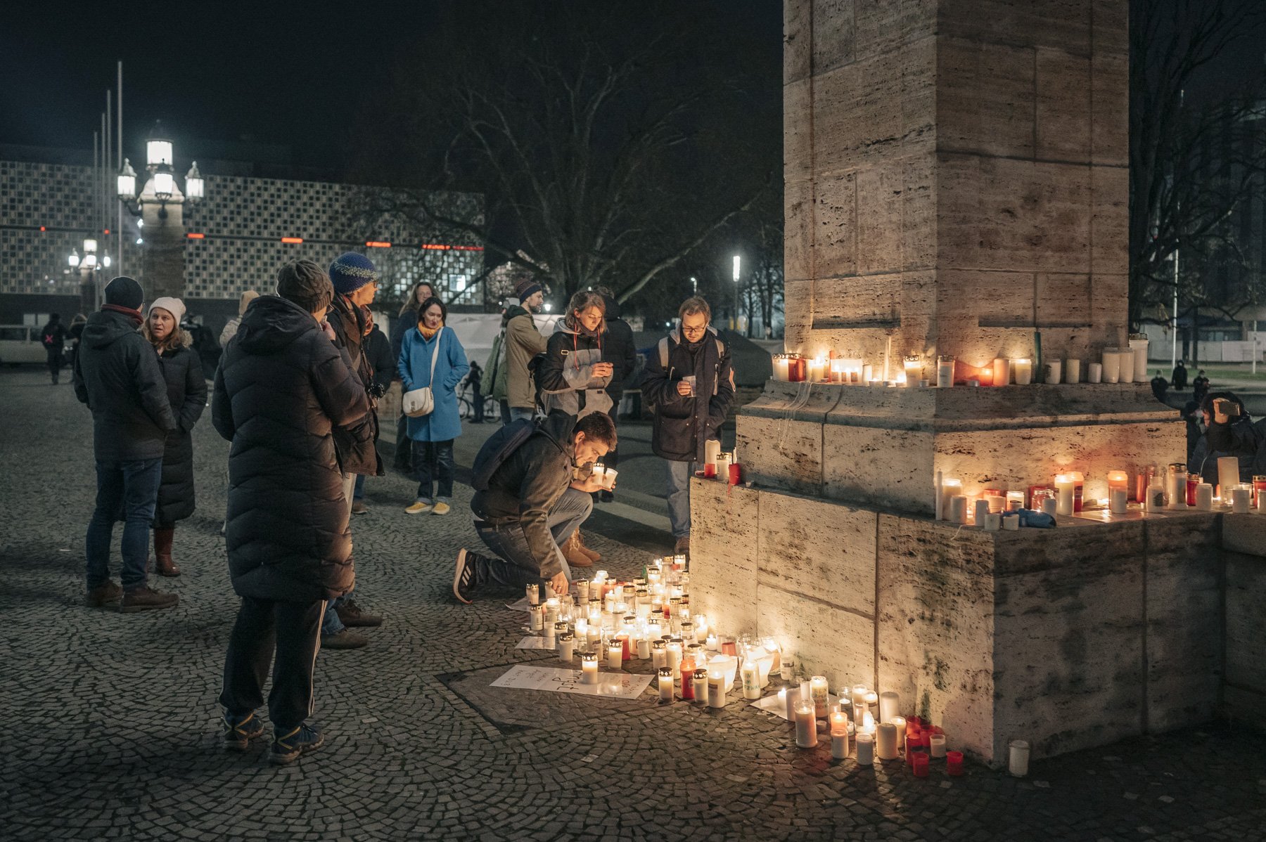  Conspiracy believers and right-wingers light candles in front of the town hall as a sign of protest against the current measures. In the winter of 2021/22, demonstrations against the Corona measures take place every Monday evening in many German cit