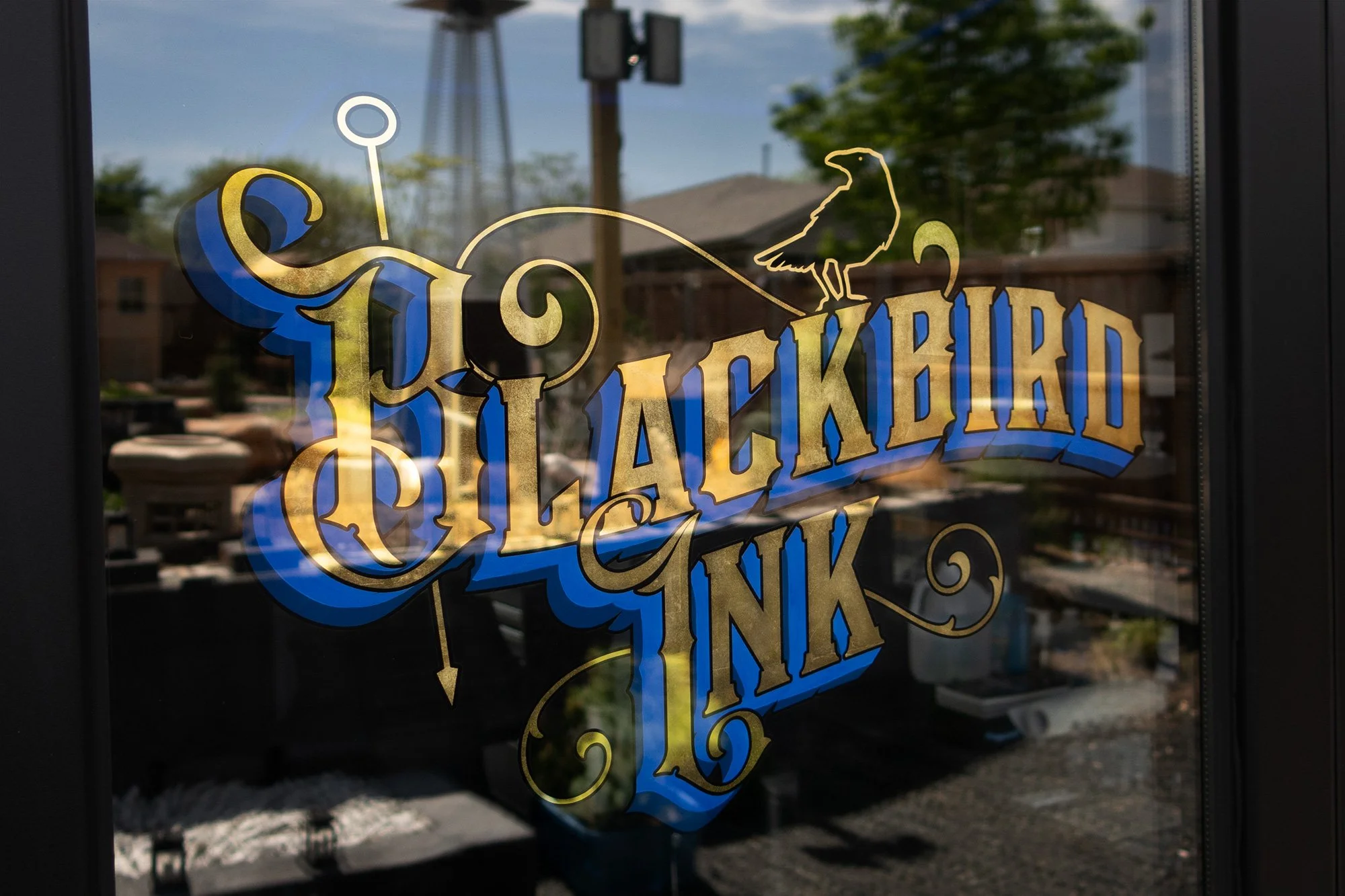 Gold Leaf on Glass Tattoo Sign