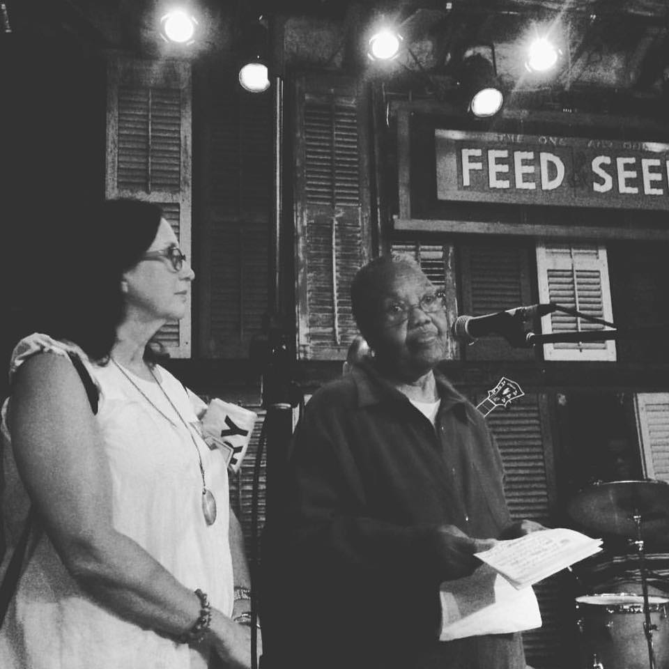 Gisele and Ms. Amy speaking during the Community Roots Benefit