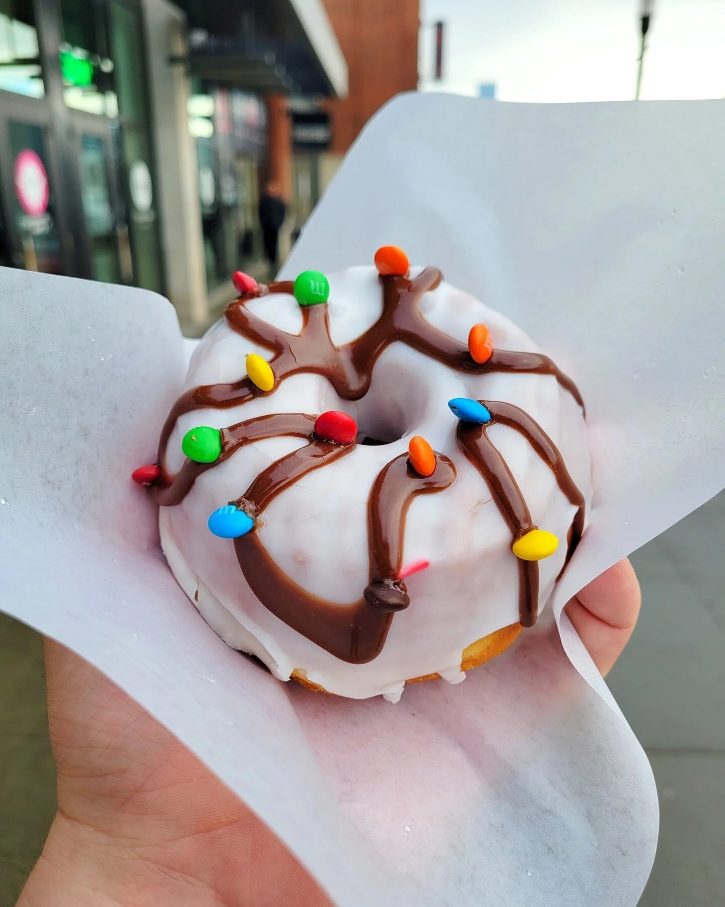 Introducing the Candy Cane Lane!🎅 

A vanilla glazed doughnut, topped with a chocolate drizzle and decorated with tiny little M&amp;M&trade;️ candy lights 🚥

Available as part of our LIMITED SUPPLY EXTRA-FESTIVE FUN FUN HOLIDAY 6-PACK, available fo