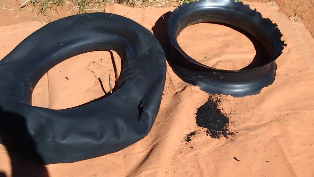 The remnants of a puncture on a split rim tyre with tube. This would not happen with a tubeless tyre.