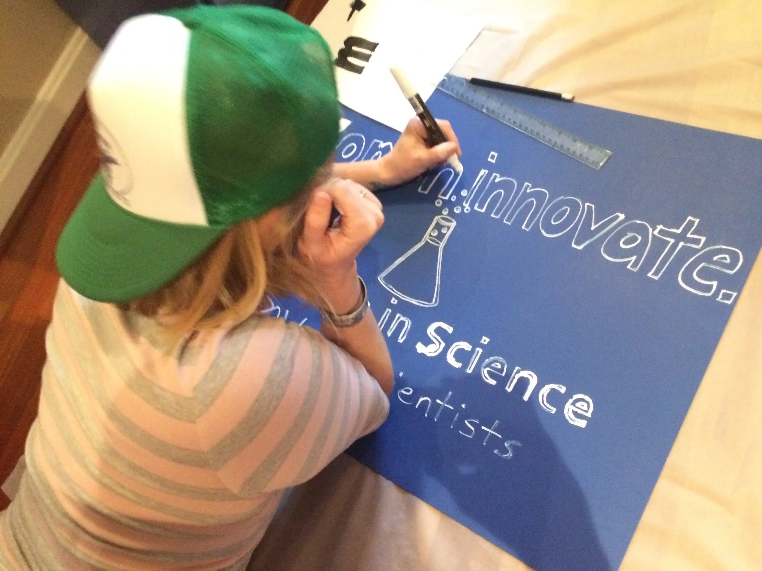 A DC Pod member making a sign for the Women's March on Washington 