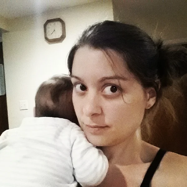 "Me with my 8 week old looking like a mom."