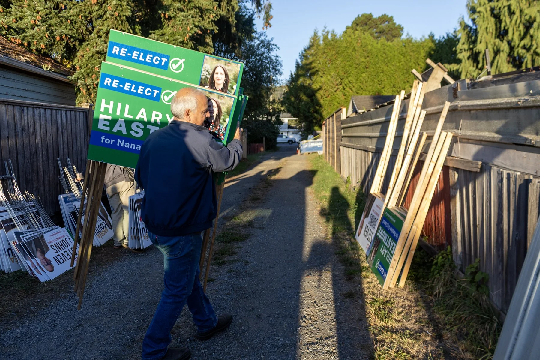 “This is what democracy is all about, right?" Volunteer sign team erect election signs around Nanaimo