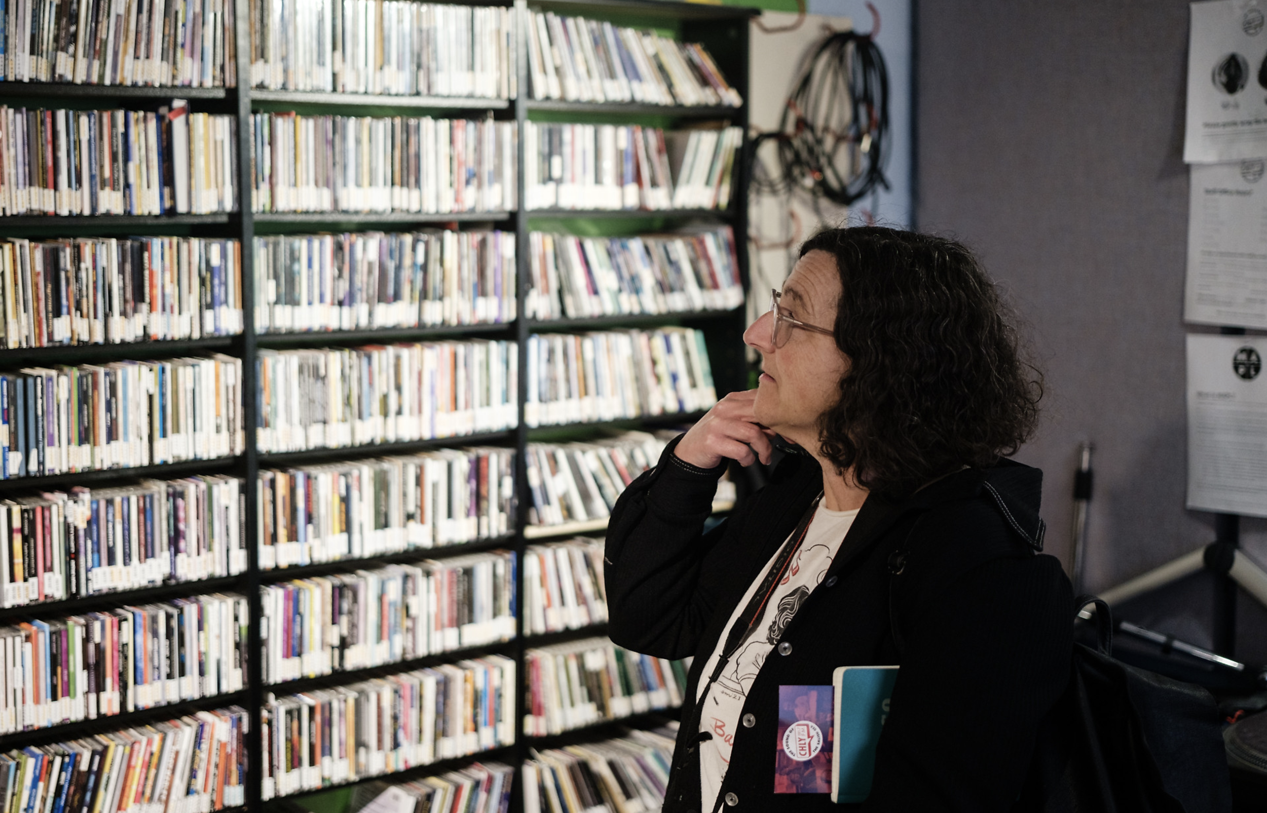 DLARC curator Jennifer Waits inspects the library.