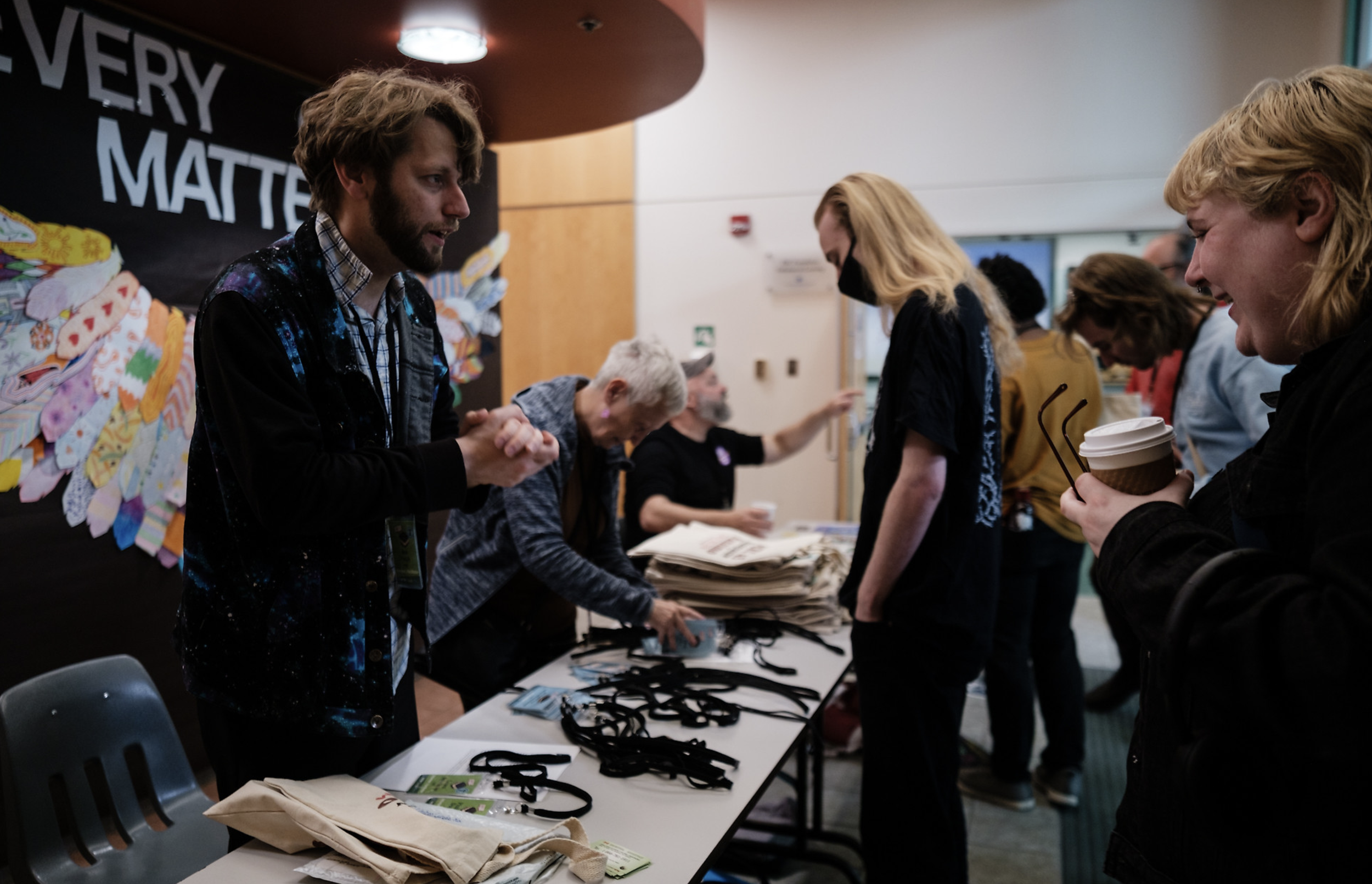 Host Joe Pugh welcomes attendees at registration.