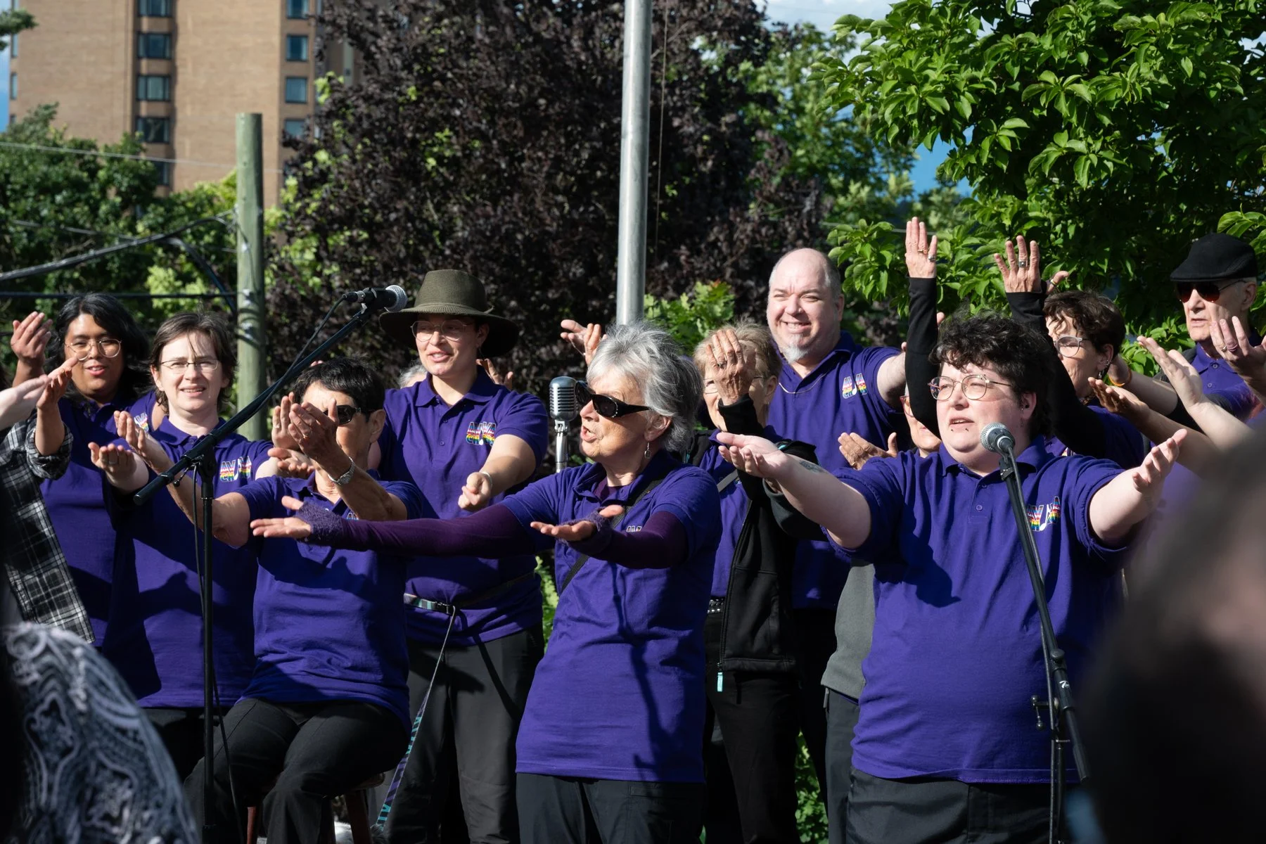 The Aviva Choir sings at the Pride flag raising for 2026.