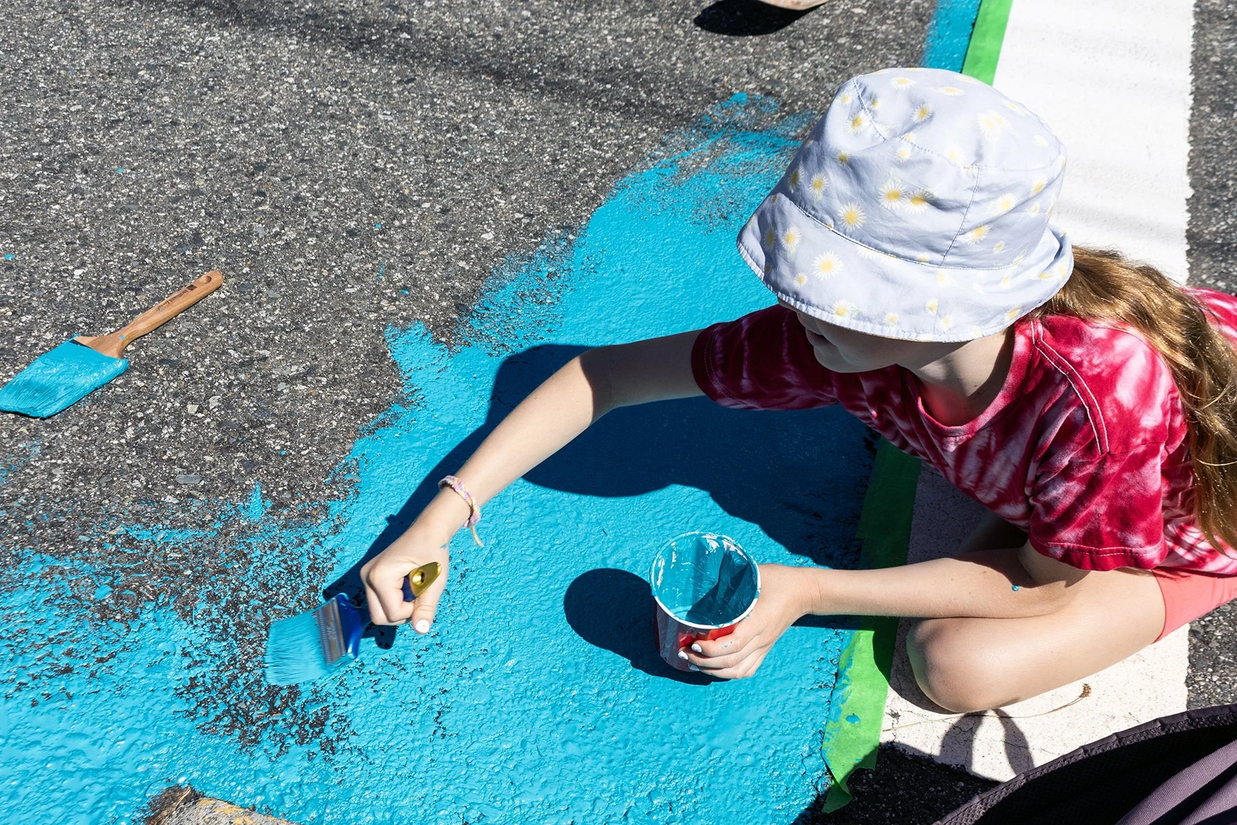 Ten year old Miriam said she is going to be excited to walk past the mural every day on the way to school knowing she helped work on it. 
