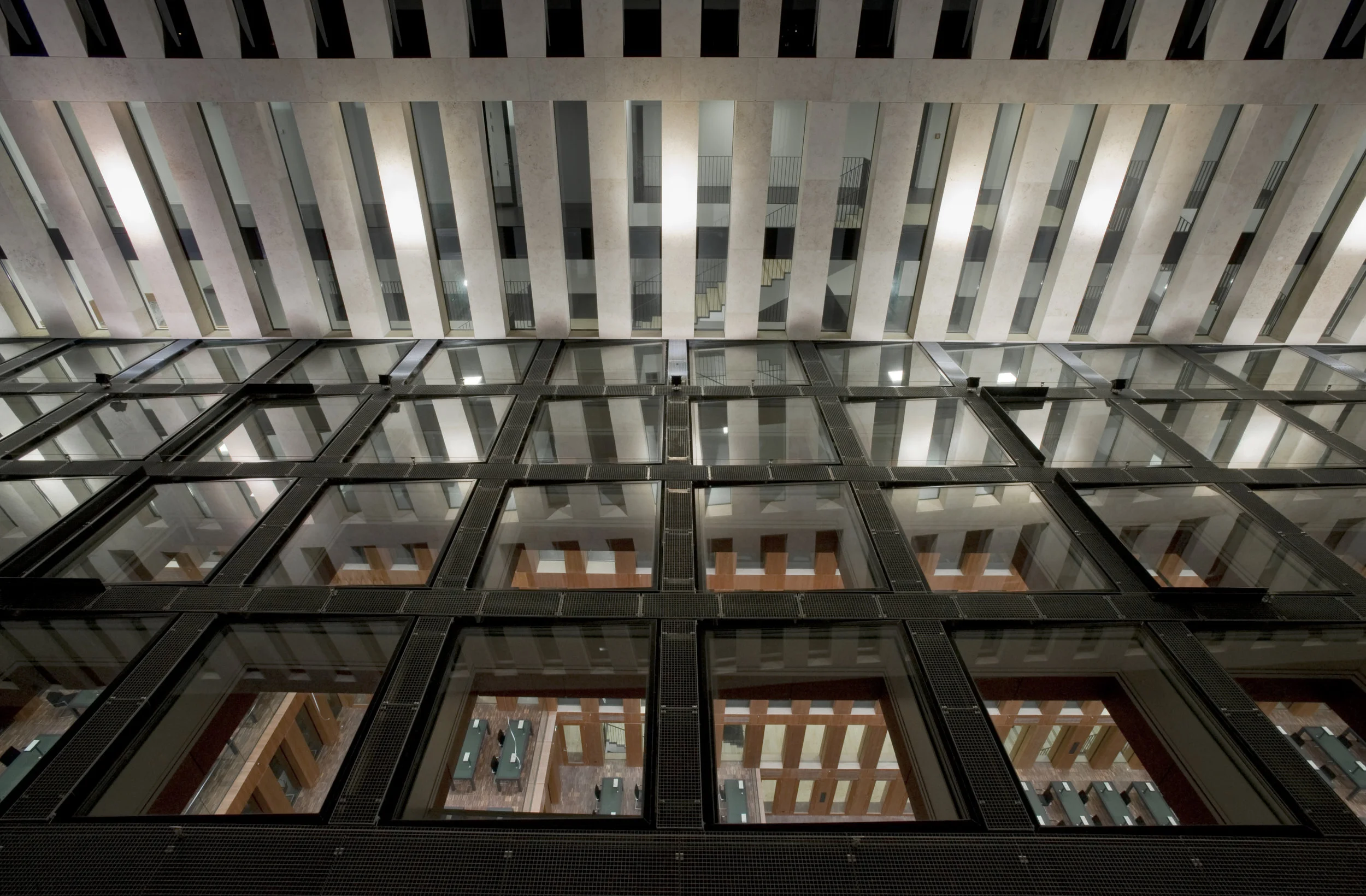 Drainage must always be the first priority. Looking down through atrium skylights to the office below. Note integrated 3 degree pitch that allow for optimum water management, and avoids stains from standing water.