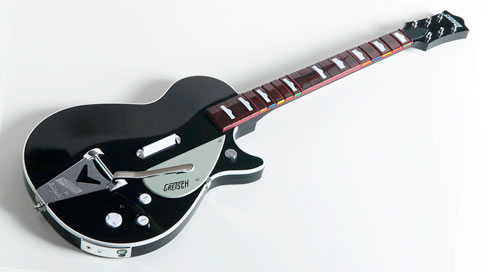 The Beatles: Rock Band adds four new instruments to the plastic pile, including this Gretsch guitar, as made famous by George Harrison.