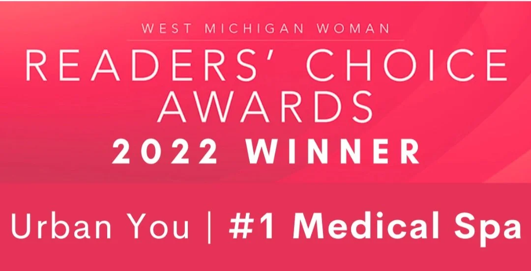 Pink background with white text announcing West Michigan Woman Readers' Choice Awards 2022 winner, Urban You, as #1 Medical Spa.