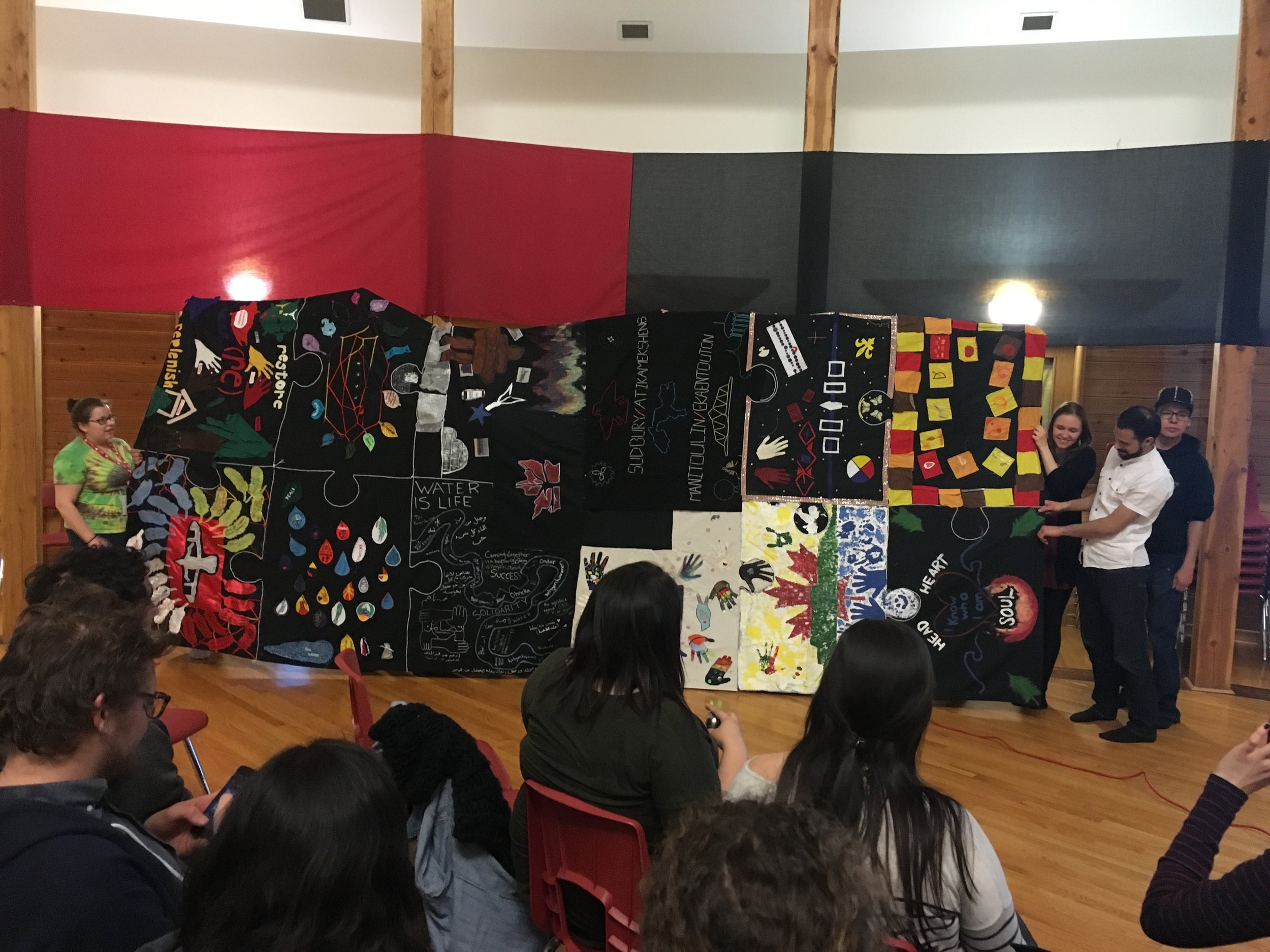The "Story Blanket" presented at Thunderbird House by the Youth Reconciliation Initiative. Every part of the blanket was completed by a different community, with each patch symbolizing different forms of reconciliation.