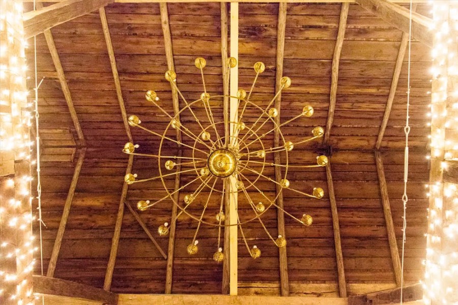 Stunning Chandeliers - Your guests will dine in soft romantic lighting beneath vintage chandeliers and massive hand-hewn beams wrapped in twinkle lights.