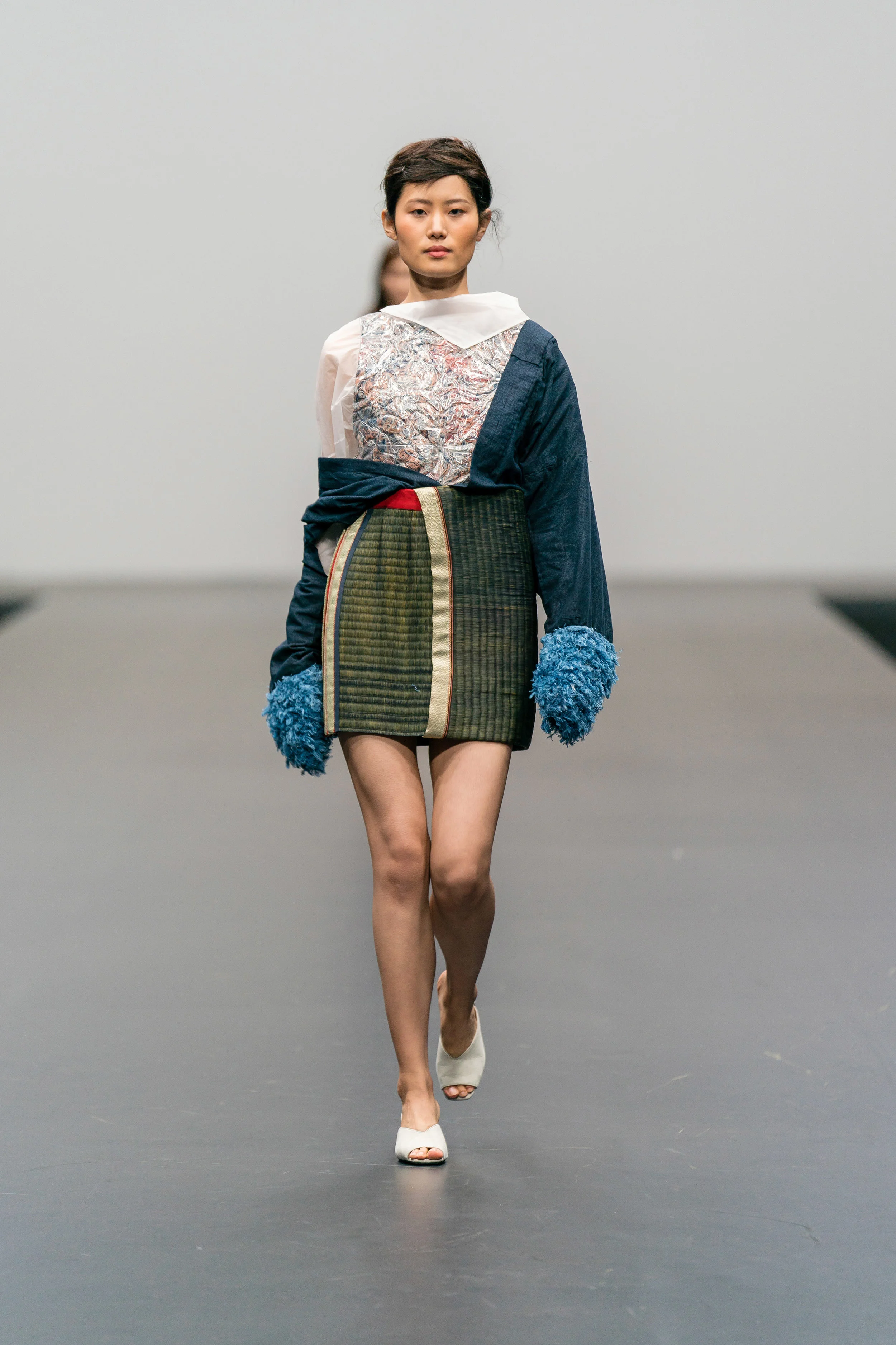 Ayako Yoshida Up-cycled multicolour top made from secondhand textiles and damaged umbrellas, paired with up-cycled tatami skirt and wrap jacket reconstructed from secondhand kimonos