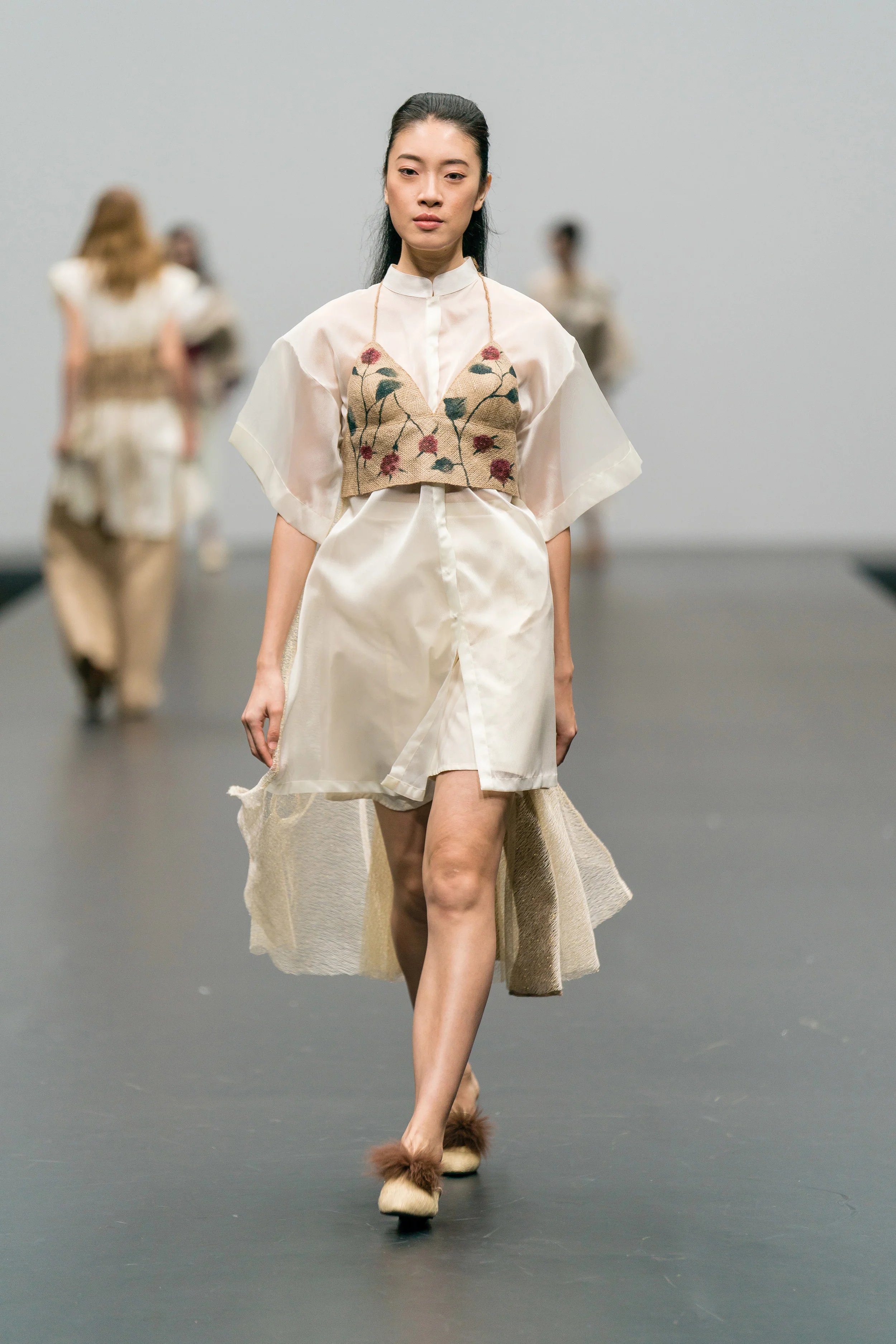 Sarah Devina Susanto Up-cycled sheer shirt layered with a white skirt and hand-painted backless jute top, made from end-of-rolls and secondhand textiles