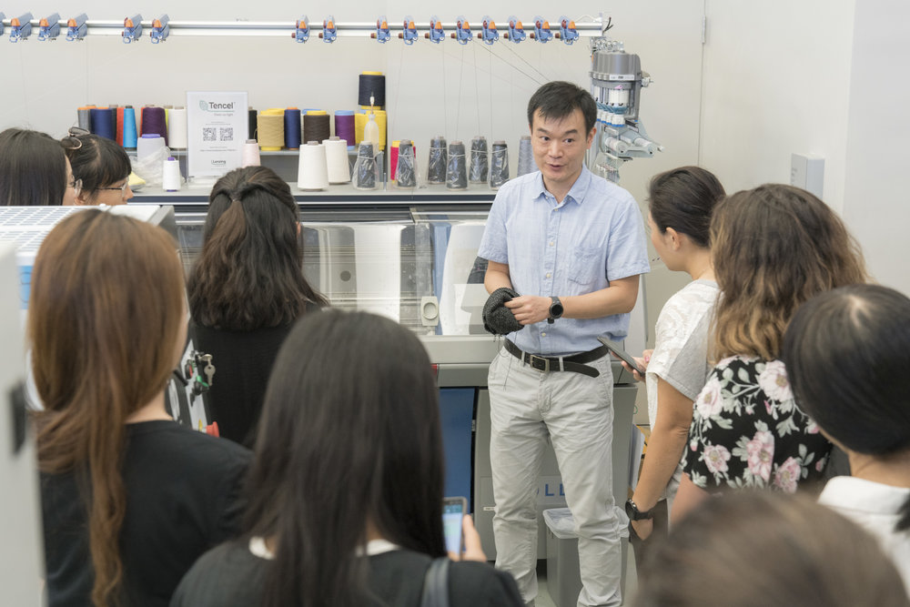 Lenzing leads a tour of their Hong Kong facility for educators and students