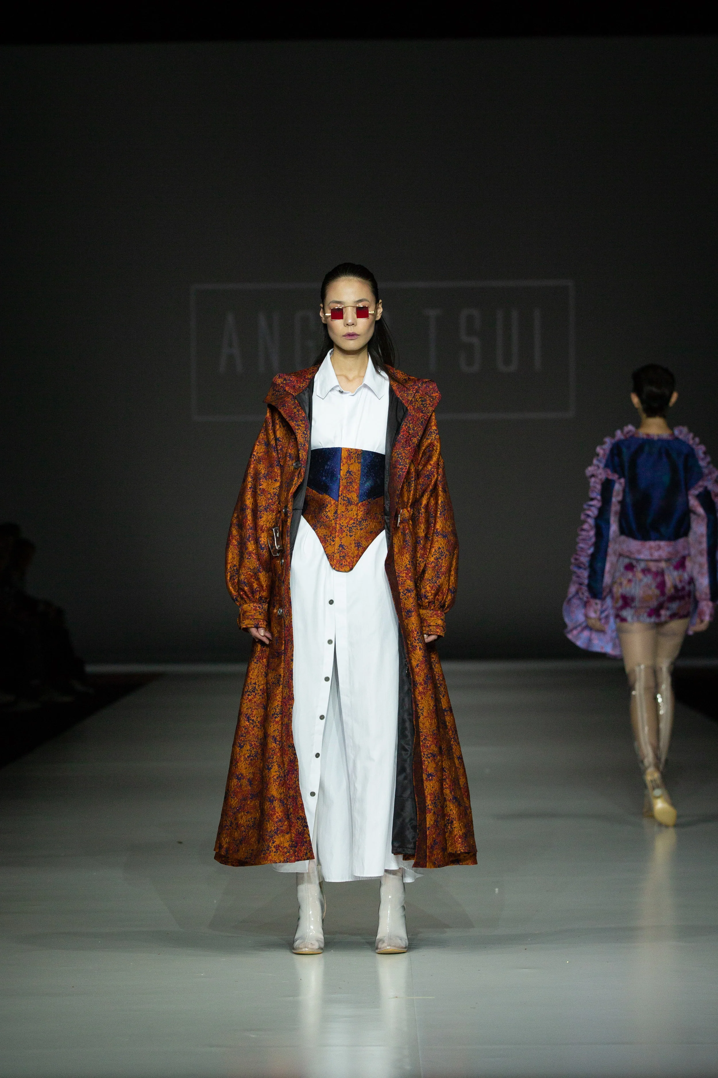 ANGUS TSUI Angus Tsui - Redress Design Award Hong Kong 2012 People’s Award Winner Oversized Lantern Sleeve Coat, oversized long shirt, paneled corset and shorts, up-cycled from excess fabric stock and end-of-rolls sourced from Hong Kong companies and social enterprises. Enquiries: info@angustsui.com