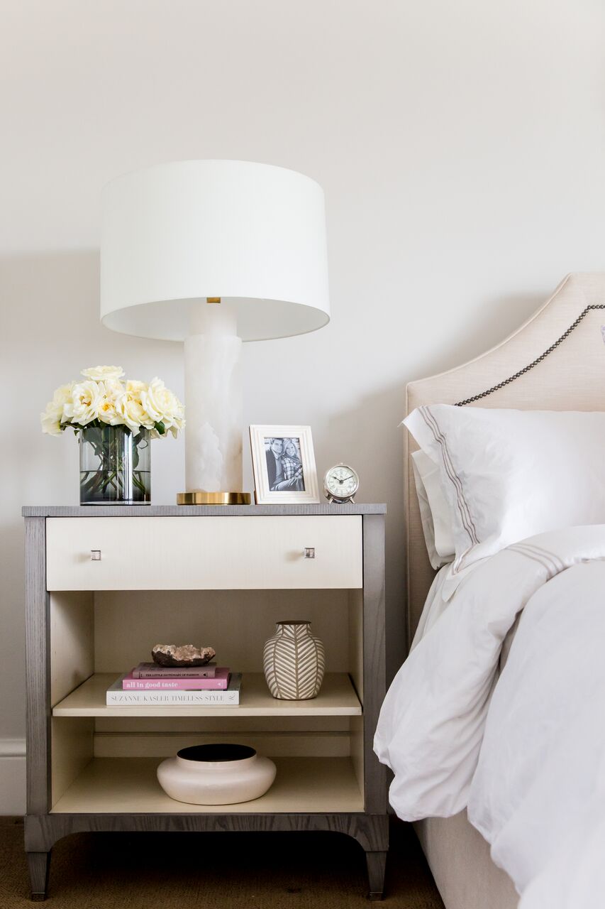 Our current nightstands have a big open space (without a shelf) that is incredibly hard to style. This photo though makes me entertain the thought of adding vases and books to fill and style the space. 