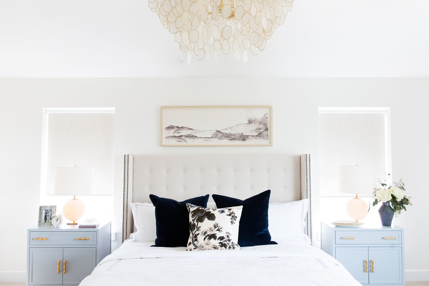 This is very similar to our current bed frame, but I really like how tall the headboard is on this one. It seems to elongate the room. Also, the dark pillows are a great look!