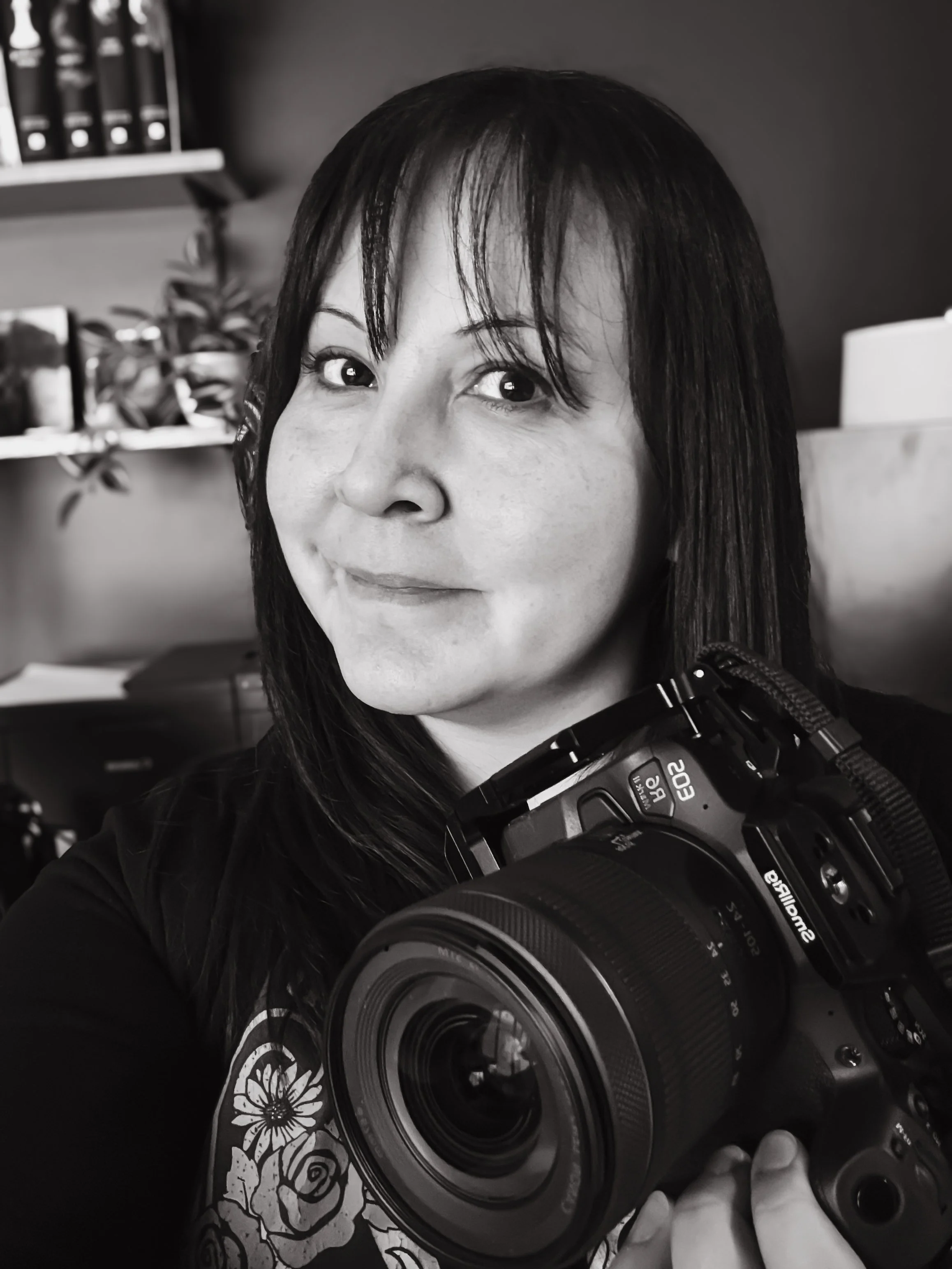 woman holding camera portrait