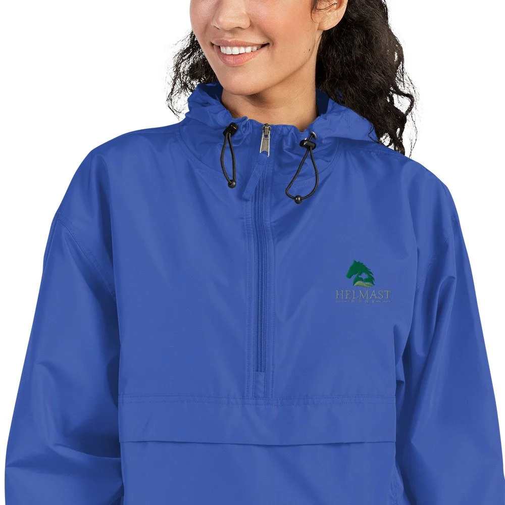 embroidered-champion-packable-jacket-royal-blue-zoomed-in-64cf526b8effd.jpg