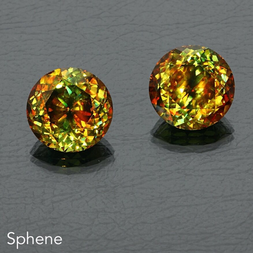 Sphene 2pc-22.69ct RedGreen Rd pair db 07112 2.JPG