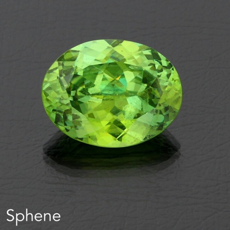 Sphene 22.24ct Zim oval Green AB db 15699 1.JPG