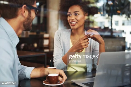 http://www.gettyimages.com/detail/photo/business-people-talking-in-cafe-royalty-free-image/457983989