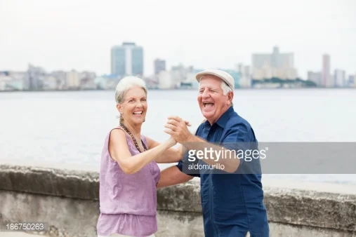 http://www.gettyimages.com/detail/photo/senior-hispanic-couple-dancing-outdoors-royalty-free-image/109348282