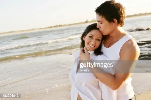http://www.gettyimages.com/detail/photo/enthusiastic-brunette-couple-hugging-on-beach-royalty-free-image/563876641