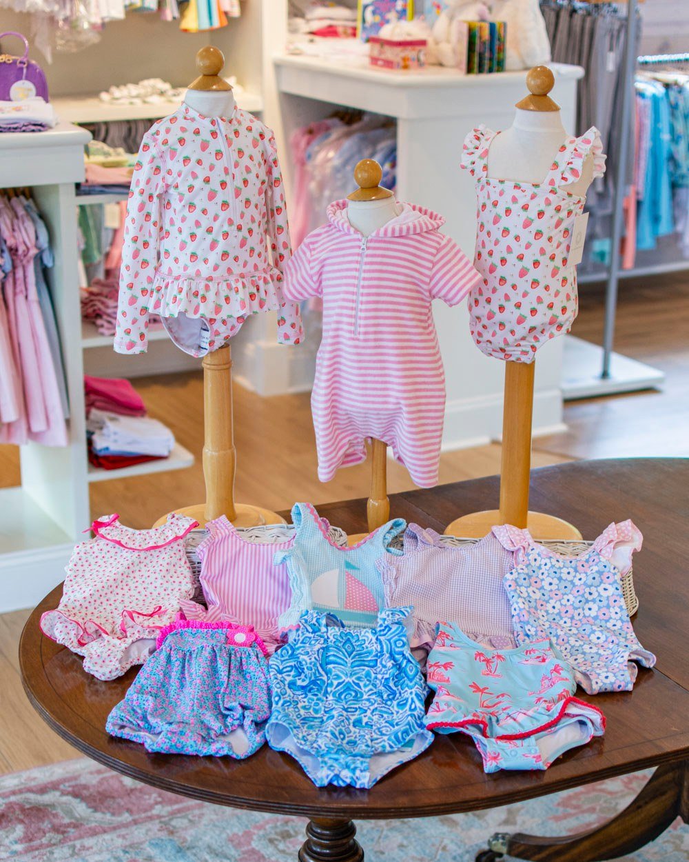 ☀️ Little girl bathing suits in a variety of styles! The strawberry print is from The Proper Peony. 🍓