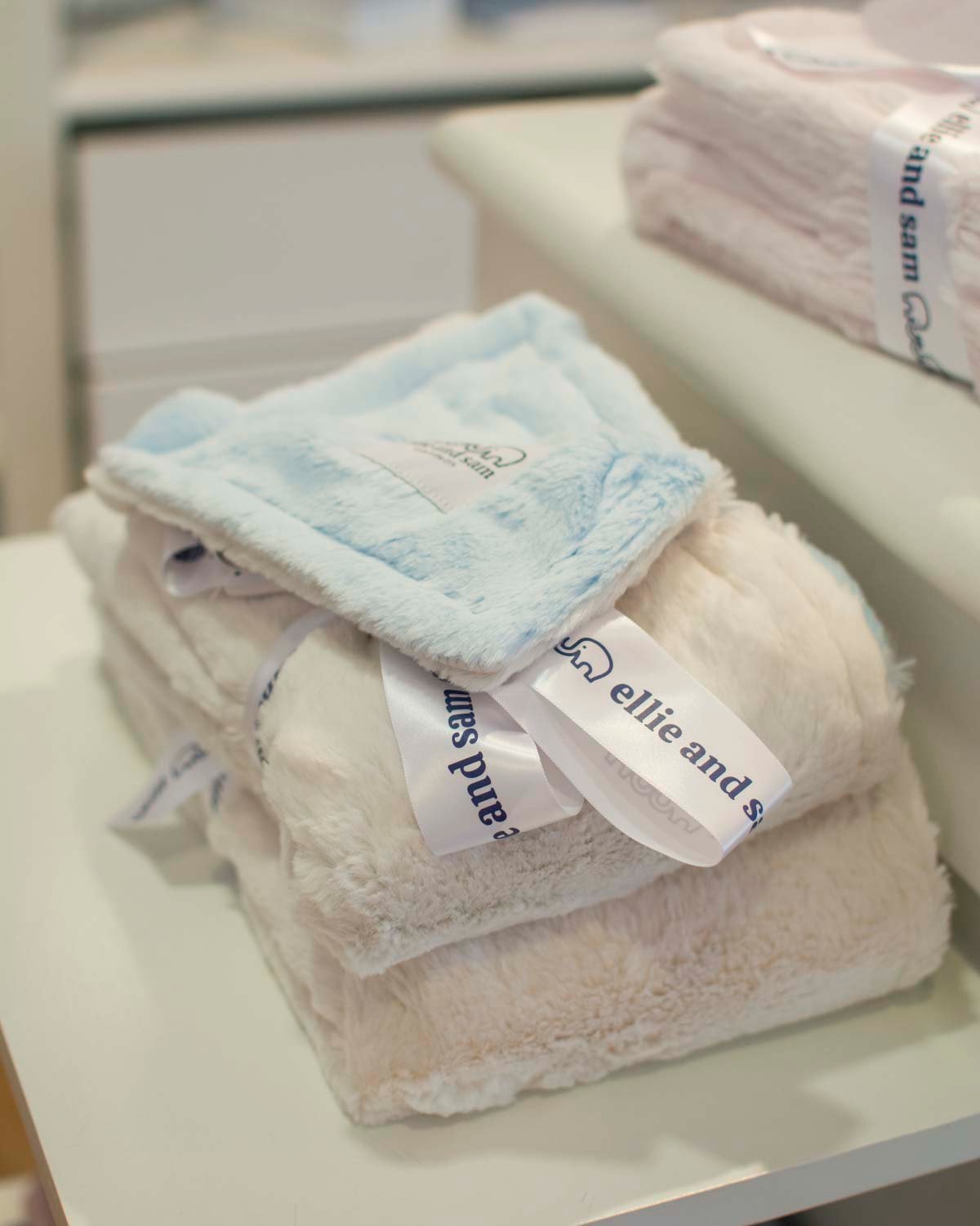 Ellie and Sam are our new brand of amazingly soft and silky baby blankets. We carry them in a variety of styles and colors for all seasons!