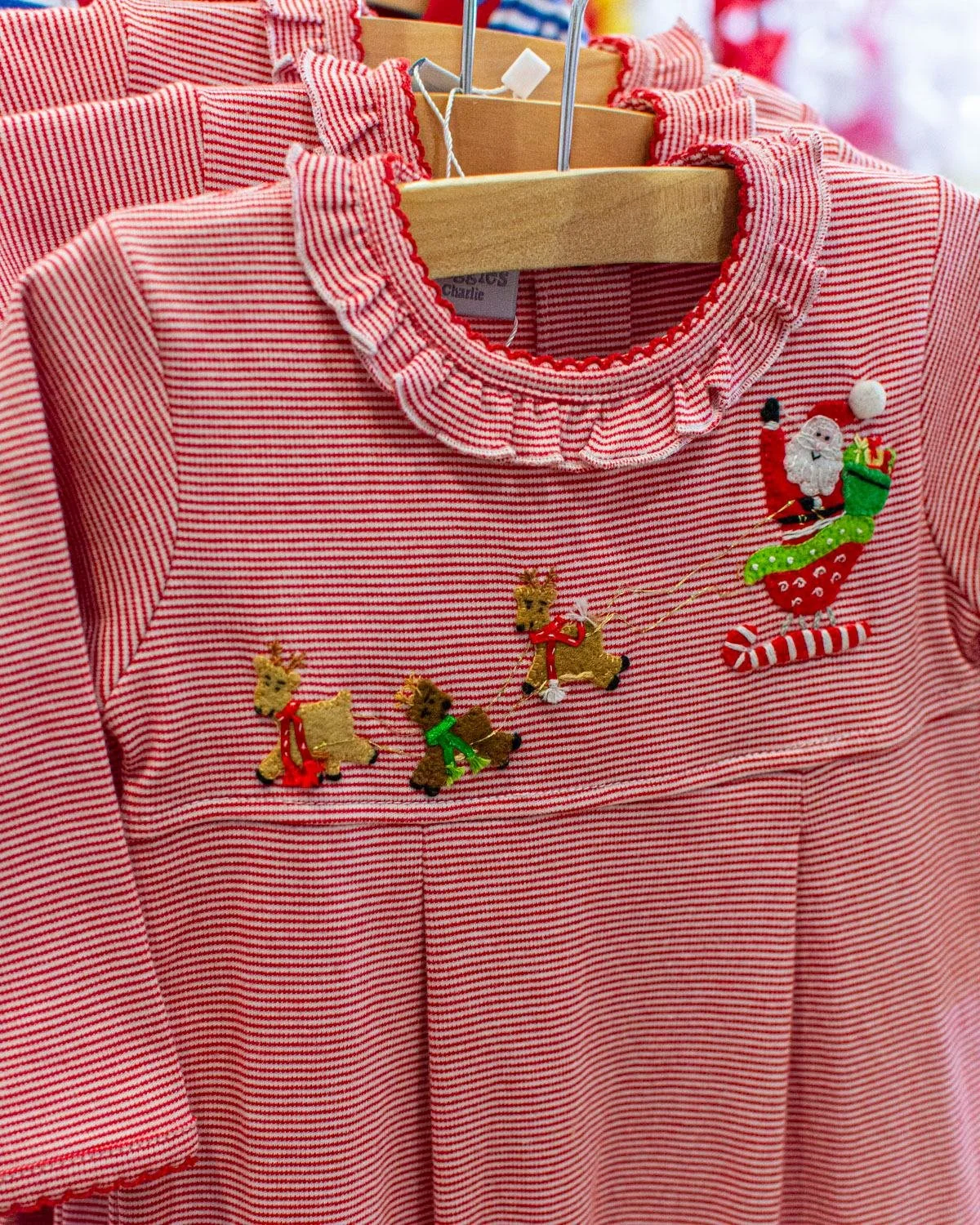 Love the detailing on this romper from Squiggles, along with matching tops for boys.

#charlottenc #childrensclothing  #shoplocalnc #shopsmallclt Children's Boutique Charlotte