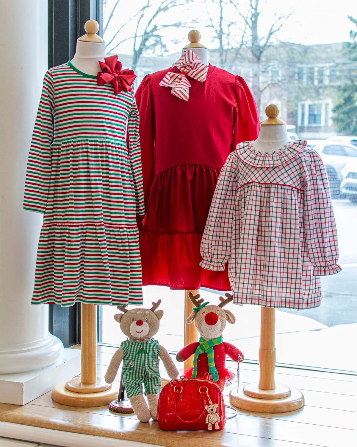 A candy cane colored front window ❄️ Dresses and styles from Luigi, Pleat, Beaufort Bonnet, Velani and more. Plus the perfect bow to top off in style!

#charlottenc #childrensclothing  #shoplocalnc #shopsmallclt Children's Boutique Charlotte