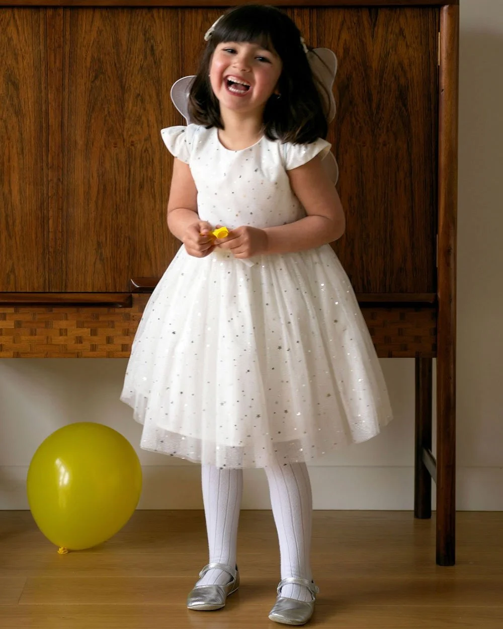 Two stunning sparkle dresses worthy of the Sugar Plum Fairy! The Sparkle Star Dress in White from Rachel Riley, and the cream two-piece sequined dress from Mayoral. 🤍🤍