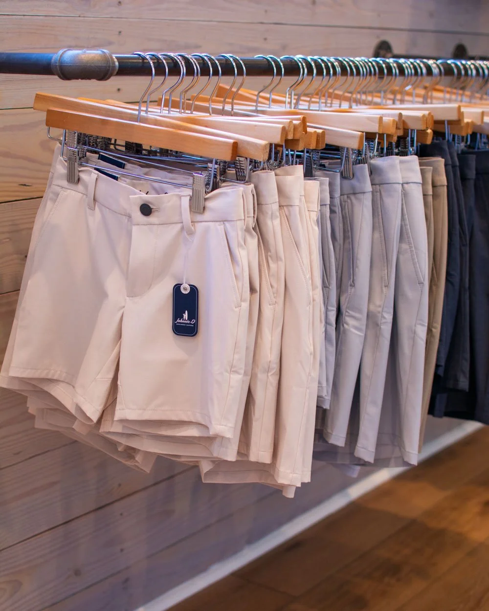 Just in! The new Stone color is a light khaki with performance fabric and a synch interior waistband. The Palisades Blue quarter zip from Johnie-O over Stone colored performance pants.