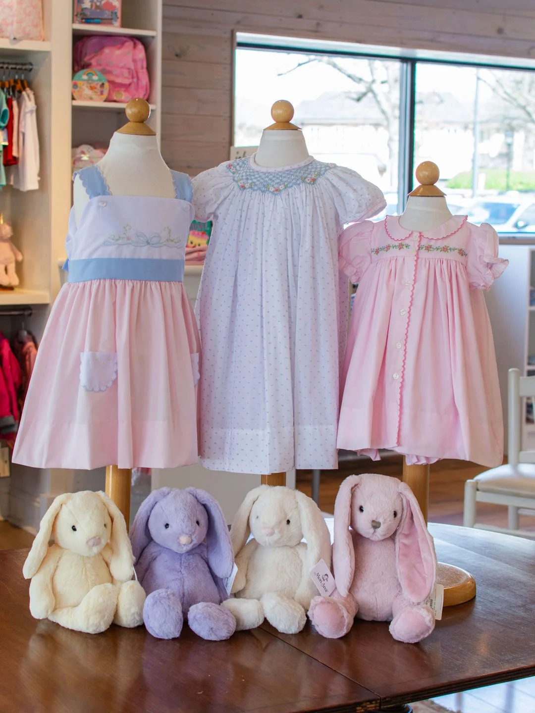 Hoppin' our way towards Easter with these darling super-soft bunnies from @monami_designs! There are so many beautiful hand smocked Easter dresses in the shop right now, here is just a sampling! 💐