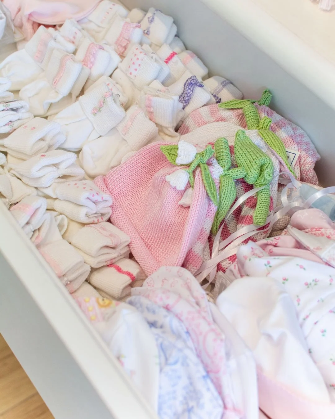 The sweetest drawers of baby socks, baby hats and baby bibs in Charlotte, NC. 🍼👶🏼 We are open today but closed on Monday, May 25 for Memorial Day!