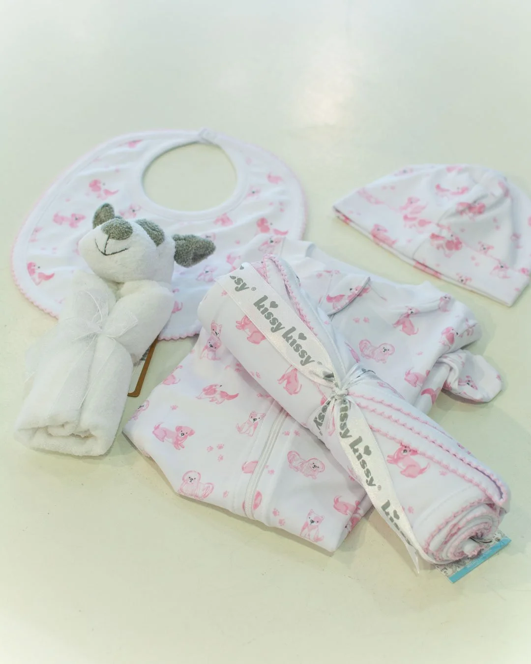 The theme is puppies! 🐶🐾🦴️ New styles in from Kissy Kissy, Anavini, puppy books and puppy stuffies. Come shop with us this weekend! We're open until 5:30 pm.