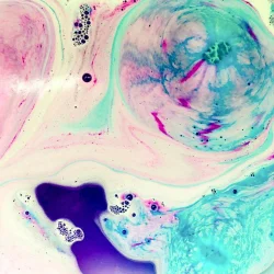 This is a pink & blue bath bomb which has been in the water for about a minute. The shot was taken from directly above the water