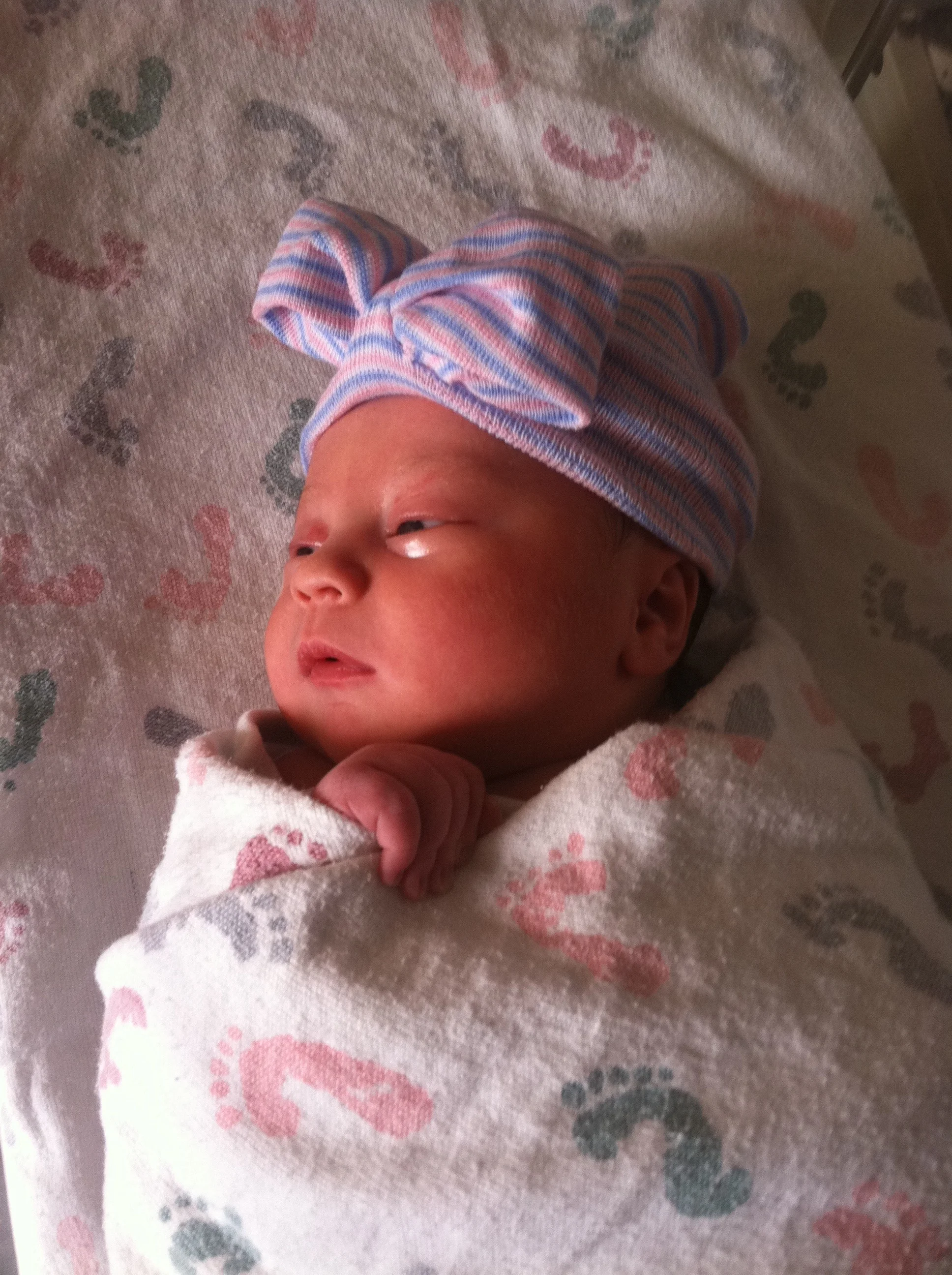 My beautiful, fiery little girl - busting out of her swaddle from the first hour. 