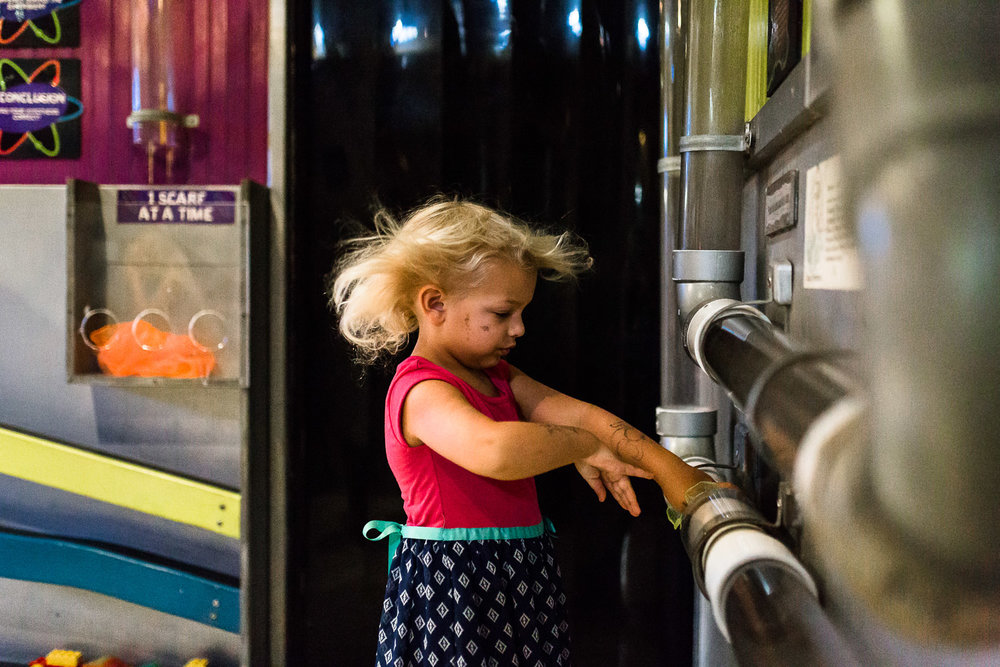 Girl with hair blowing at children's museum