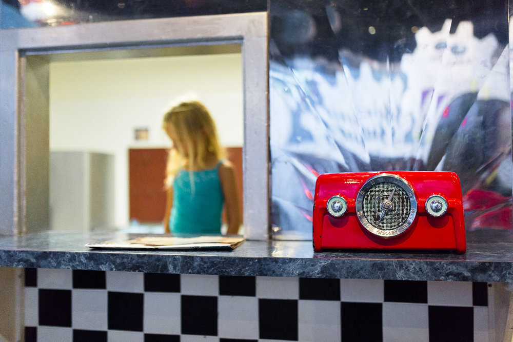 red retro radio and girl at children's diner
