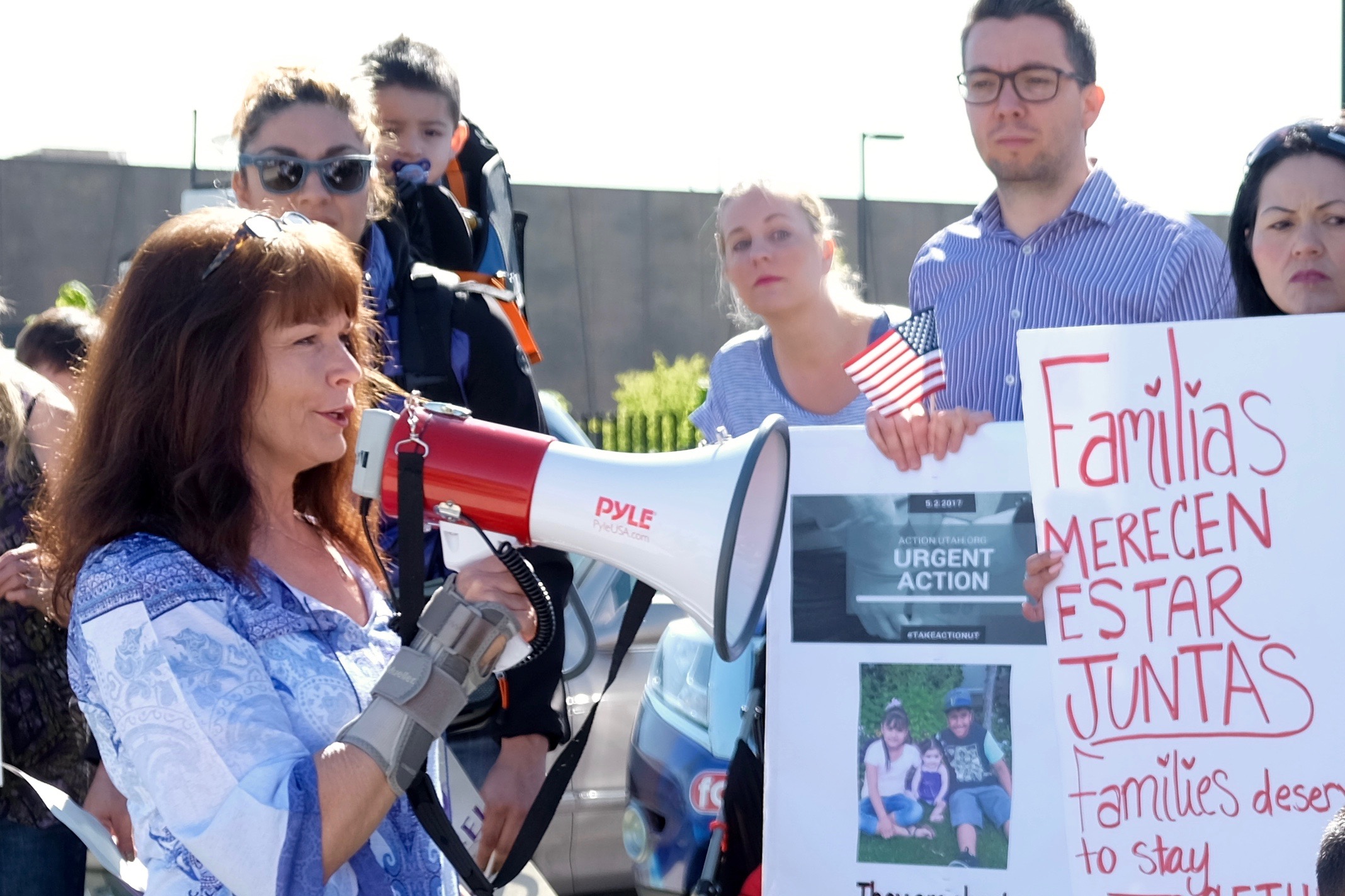 Sharlee Mullins Glenn, a founder of Mormon Women for Ethical Government, speaks to the press and a crowd of demonstrators in West Valley City, Utah. (May 3, 2017) 