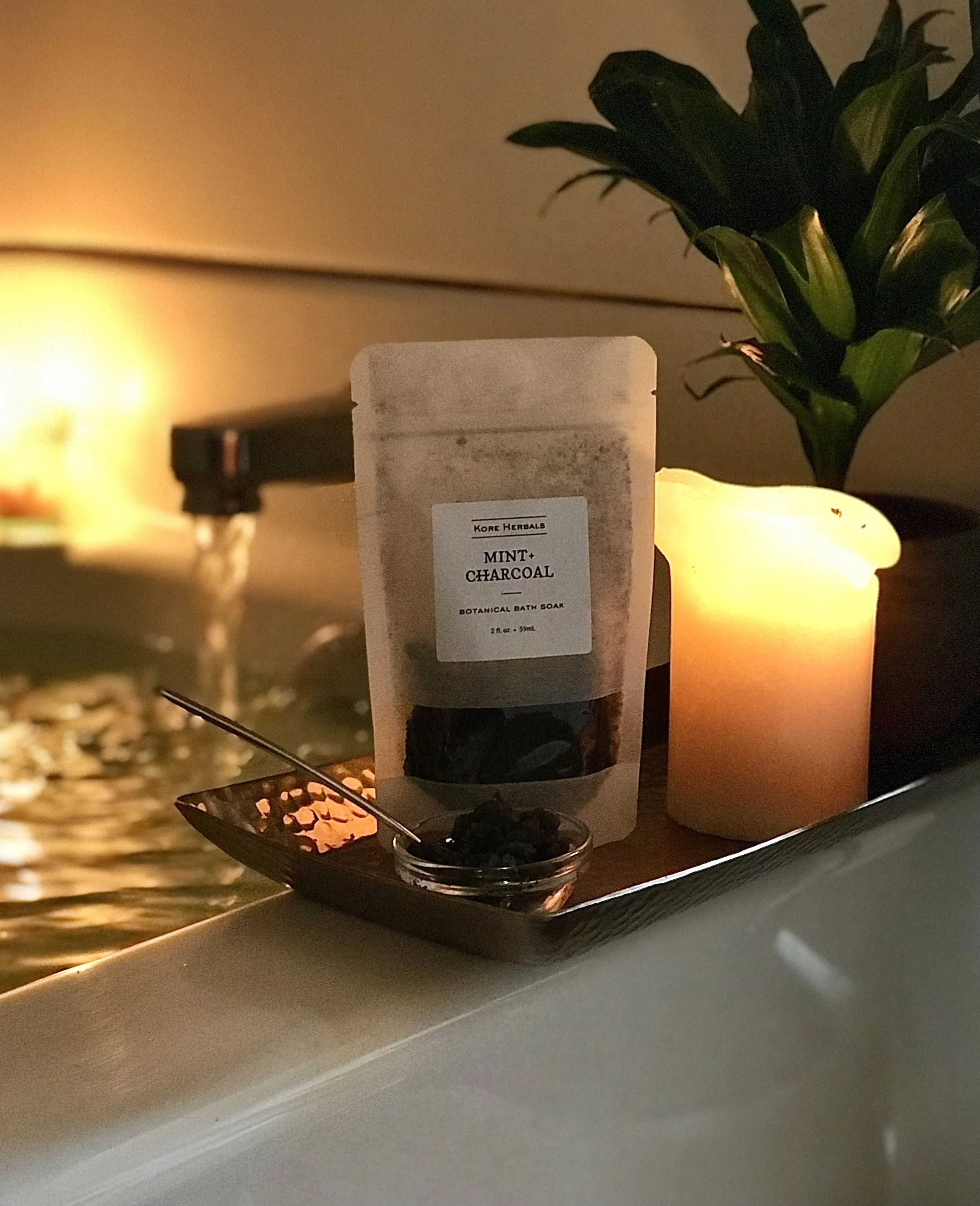 Kore Herbals Botanical Bath Salts near candle light