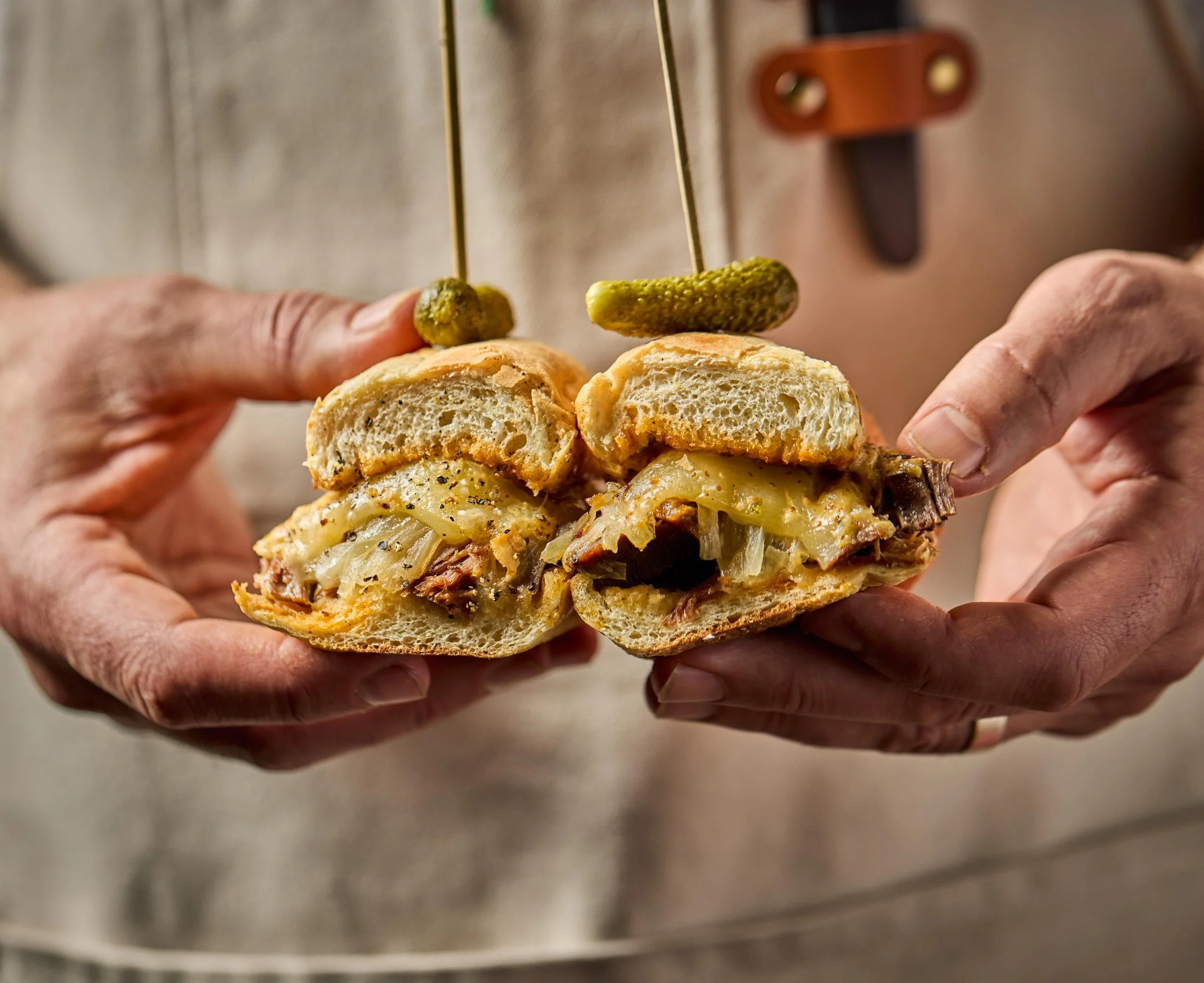 Some sandwiches are polite.

This one is not.

Ancho-chipotle rubbed brisket, braised low and slow, piled onto caramelized onion and provolone, finished with remoulade and a little au jus for good measure. Gherkins on the side because balance is impo
