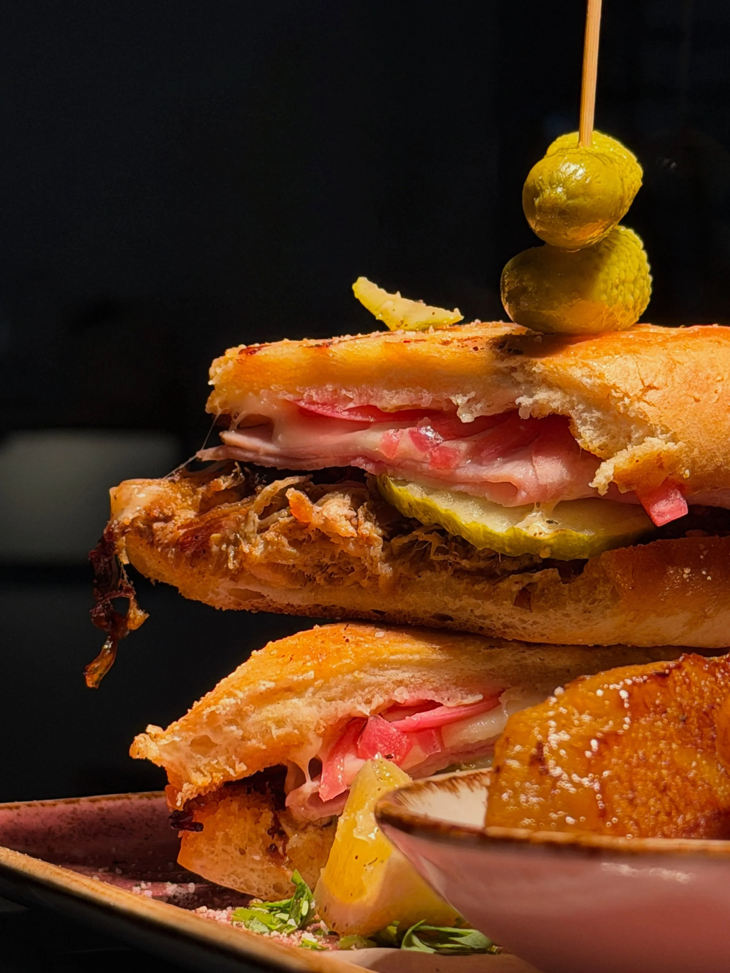 The Cubano Sandwich. It&rsquo;s here and we have zero regrets. 😉🤘

introducing our Cubano &mdash; slow roasted pork, ham, swiss, pickles, citrus-pickled red onion, pressed on a golden toasted roll. served with sweet fried plantains on the side.

th