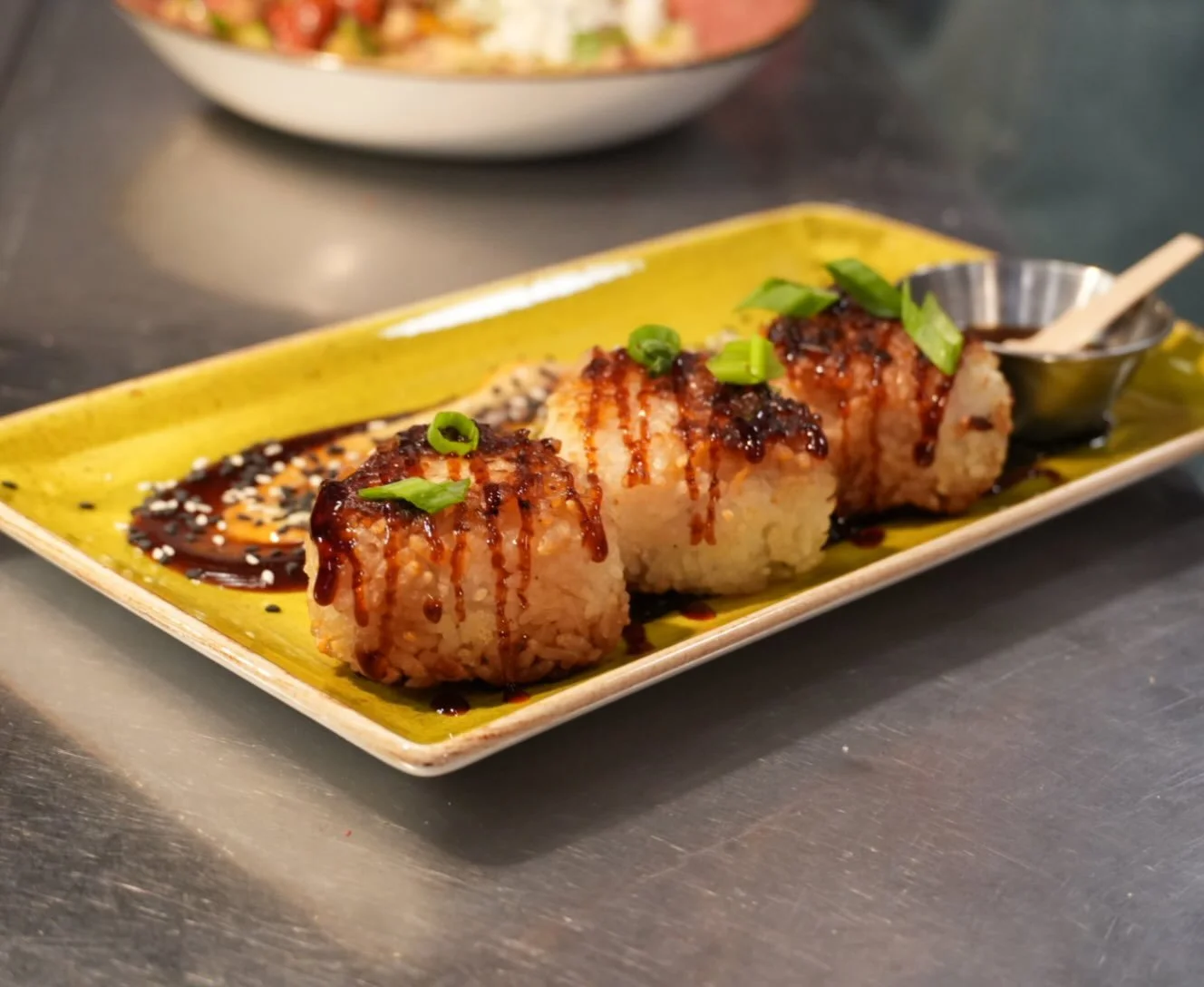 Nobody told Fort Collins about yaki onigiri yet.

We&rsquo;re fixing that. 🍙

Crispy-edged sticky rice triangles stuffed with a mix of cream cheese, charred serranos and mushroom duxelle &mdash; finished with a ponzu kick. Served with hoisin-honey s