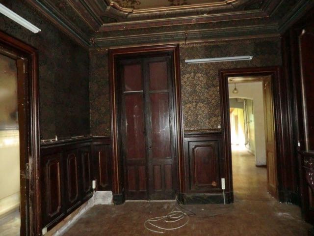 The living room. the big door leads onto the courtyard.. The smaller door leads into the kitchen that had been added on in the 50'S.