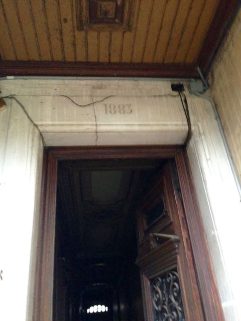 The year the house was built. 1883,Young by French standards...Back door with the initials AH scrolled in metal. We have since found out the house was owned and built for a French business man named Antoine Hautesserre, who built it for his wife Anne who unfortunately died 4 years later.